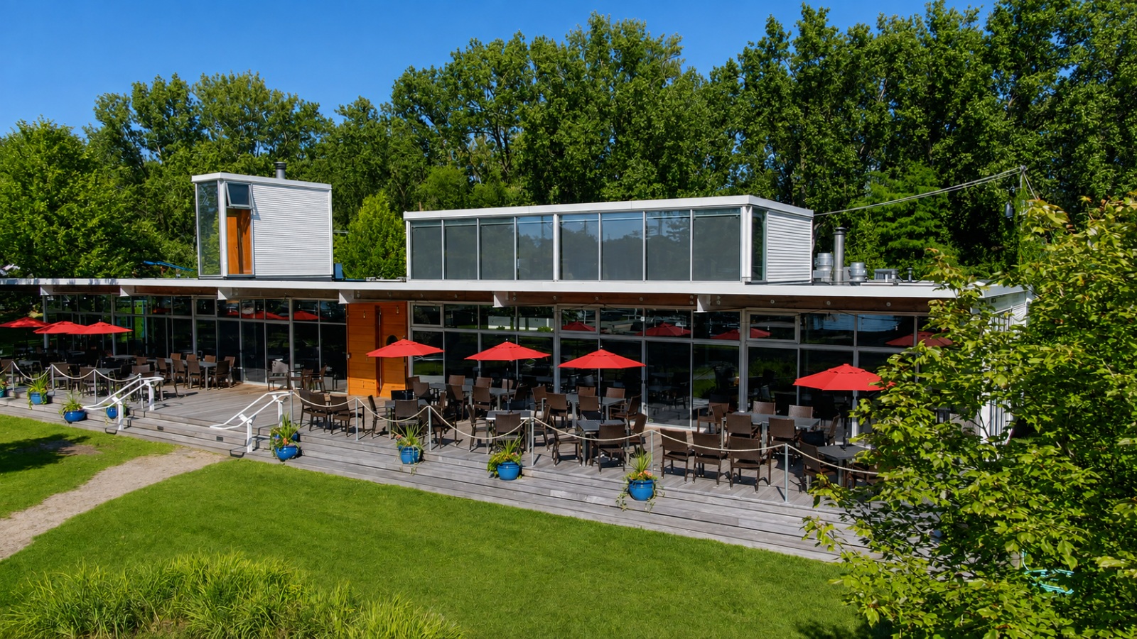 Island Yacht Club waterfront patio with red umbrellas